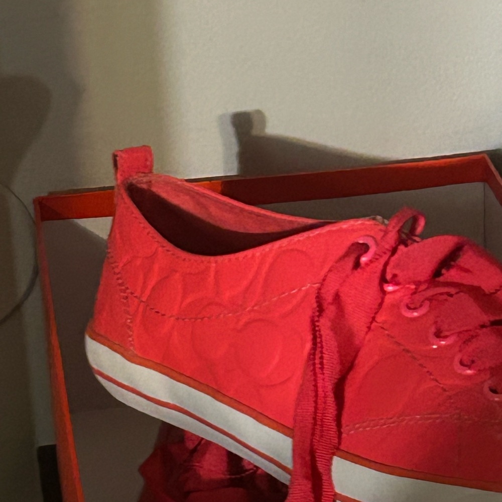 Coach pink sneakers only worn once. In GREAT condition